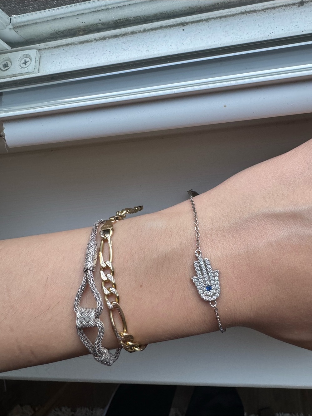 Sterling Silver Hamsa Hand Bracelet with Blue Accent and Cubic Zircona